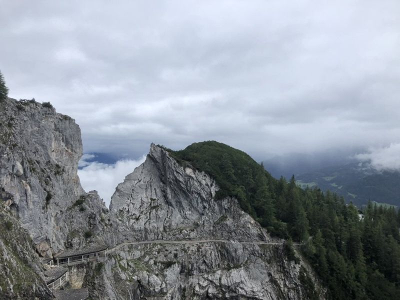 Grey limestone cliffs with a footpath cut into the rock