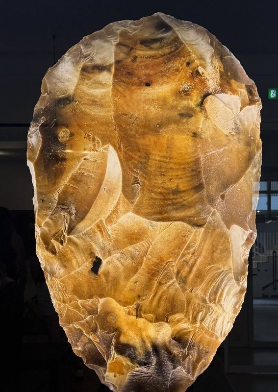 Long before writing, toolmakers shaped flint by knapping: striking flakes from the stone until an edge and a form remained.