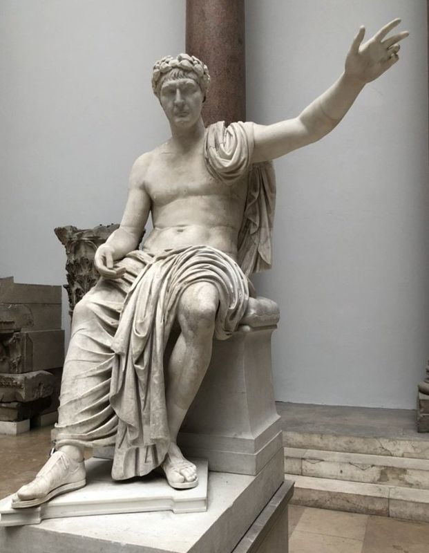 Seated statue of a Roman emperor, crowned with laurel. Marble, c. AD 115–130. Pergamon Museum, Berlin, beside the Market Gate of Miletus.