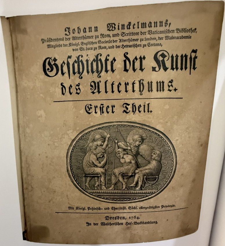 Title page in German blackletter, with an engraved oval gem of seated and standing warriors